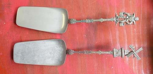 Pair of Dutch Windmill and Water Carrier Cake Lifters