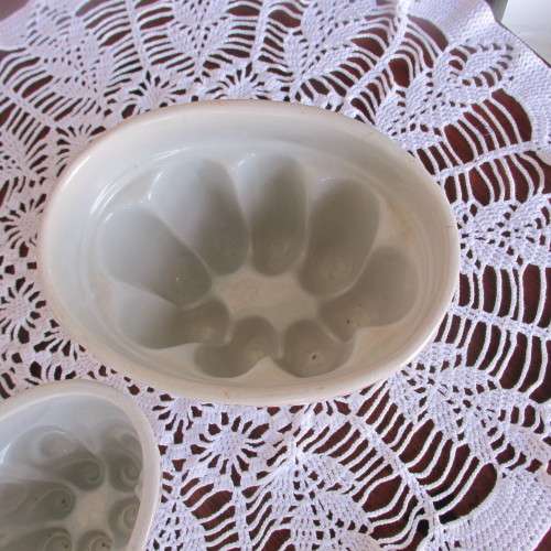 TWO UNMARKED PORCELAIN JELLY MOULDS