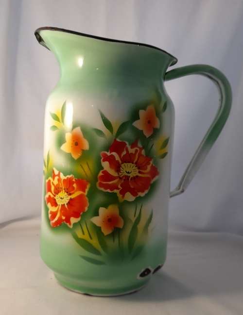 VINTAGE GREEN ENAMEL JUG WITH FLOWER DETAIL  31 CM TALL