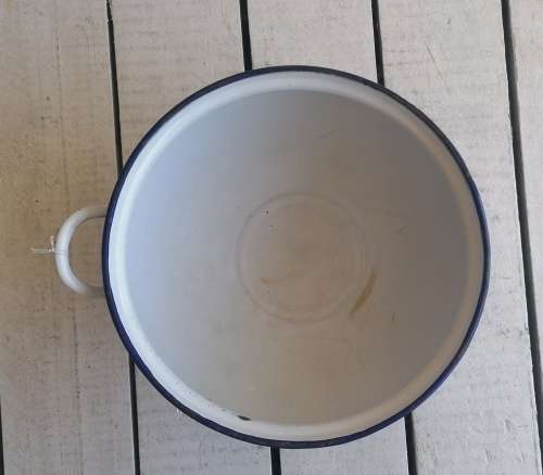 White enamel soup bowl with one handle