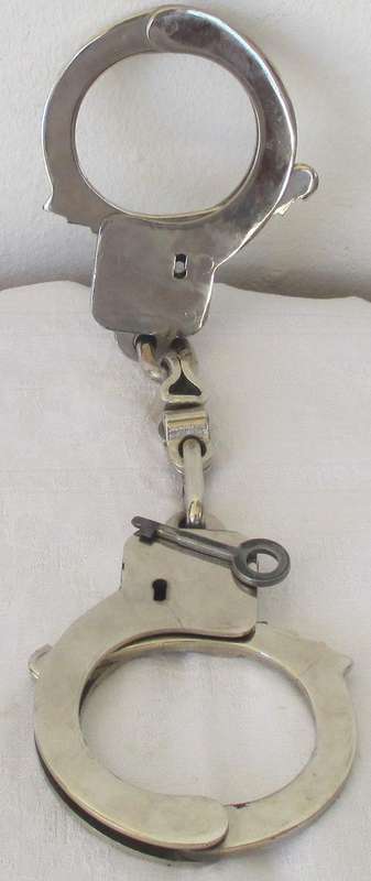 PAIR OF VINTAGE HANDCUFFS.