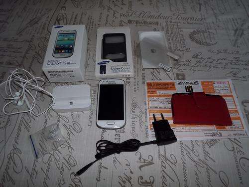 SAMSUNG GALAXY S 3 MINI CELLPHONE WITH REMAINING WARRANTY,  BOX AND NEW BATTERY,FLIP COVER,ETC ..