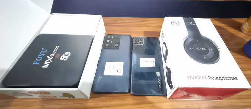 CELLPHONE BUNDLE DEAL  2 CELLPHONES + Android TV Box + Bluetooth  Headphones and Smartwatch