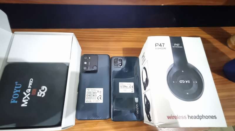 CELLPHONE BUNDLE DEAL  2 CELLPHONES + Android TV Box + Bluetooth  Headphones and Smartwatch