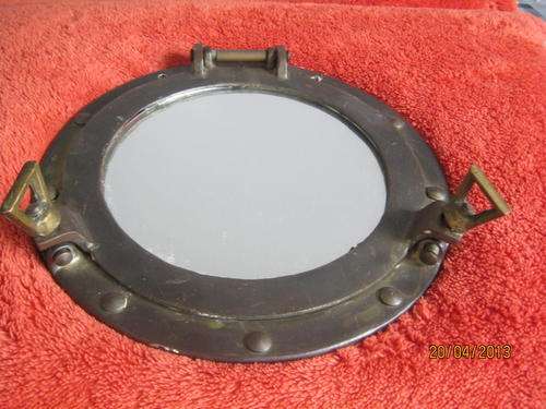 A Brass Ships Porthole with Mirror