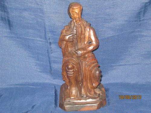 A very detailed wooden carving of MOSES holding the 10 Commandments