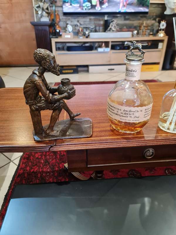 Stone Carved Old Man Drinking Traditional Drink
