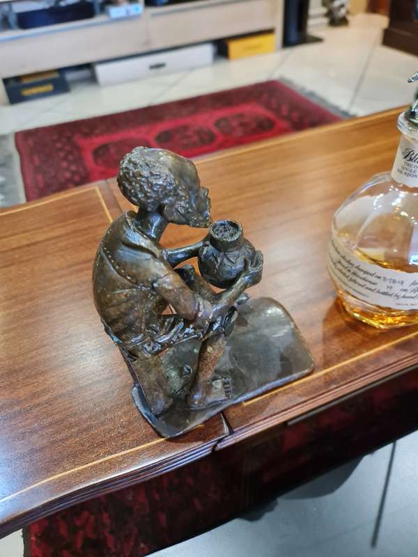 Stone Carved Old Man Drinking Traditional Drink