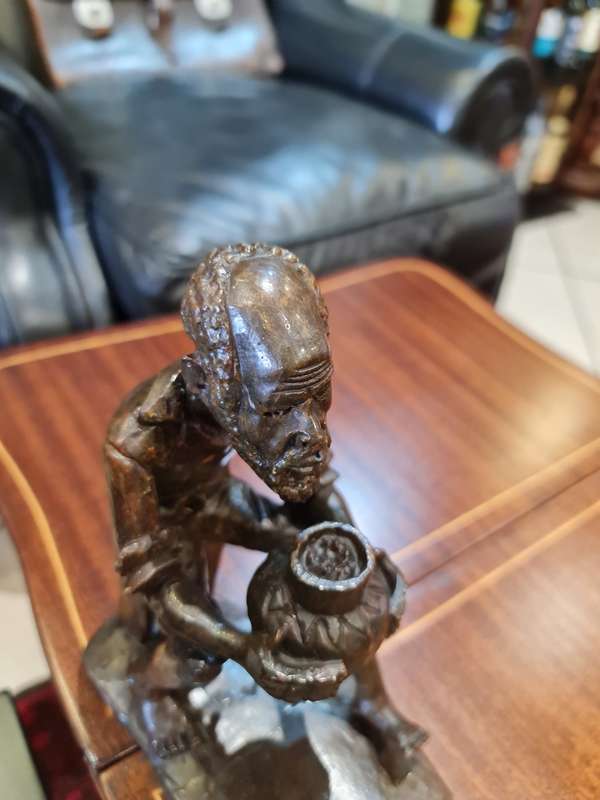 Stone Carved Old Man Drinking Traditional Drink