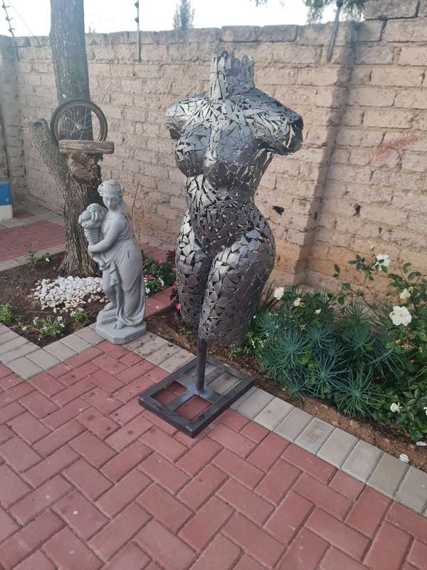 Hand Crafted Metal Female Torso Sculpture With a Metal Base