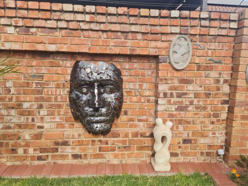 Silver Man Face Metal Sculpture