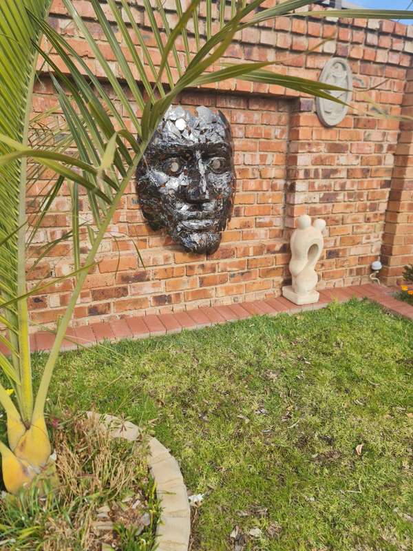 Silver Man Face Metal Sculpture