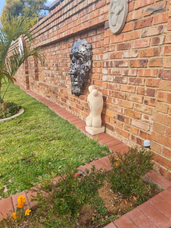 Silver Man Face Metal Sculpture