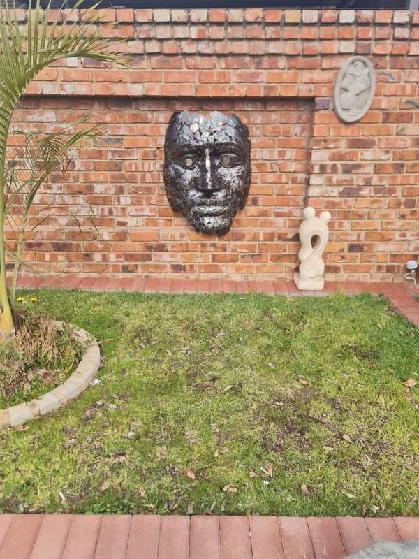 Silver Man Face Metal Sculpture