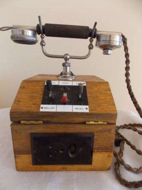 VINTAGE EXCHANGE TELEPHONE IN SOLID OAK CASE