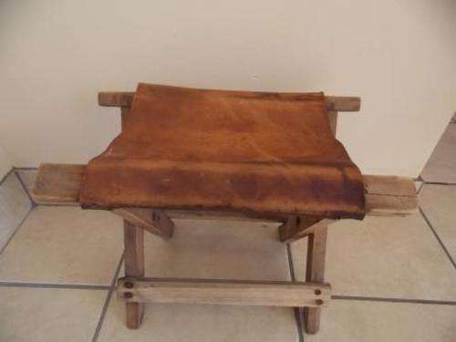 FOLDABLE CAMPING STOOL MADE FROM LEATHER AND YELLOW WOOD