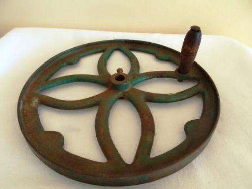 CAST IRON WHEEL WITH WOODEN HANDLE