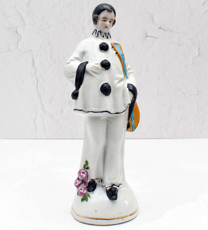 30s romantic Pierrot figurine holding a mandolin