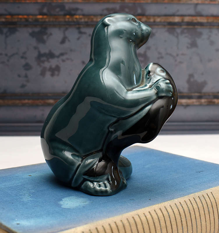Vintage Poole Pottery otter holding Fish