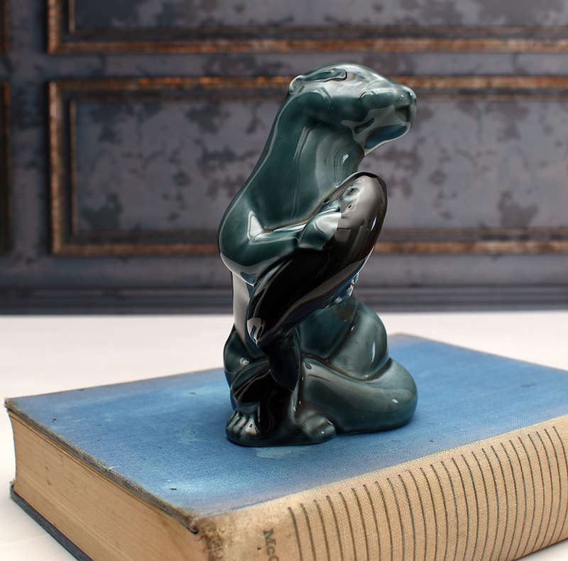 Vintage Poole Pottery otter holding Fish