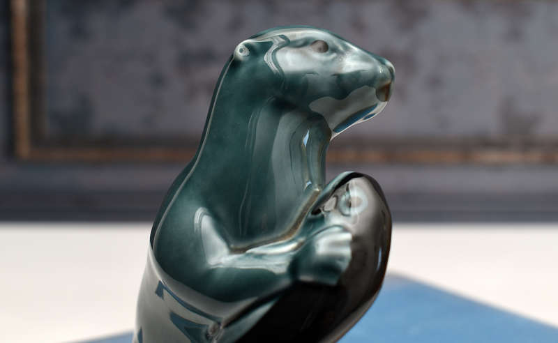 Vintage Poole Pottery otter holding Fish
