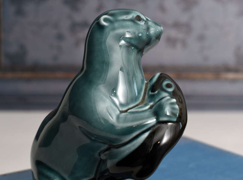 Vintage Poole Pottery otter holding Fish