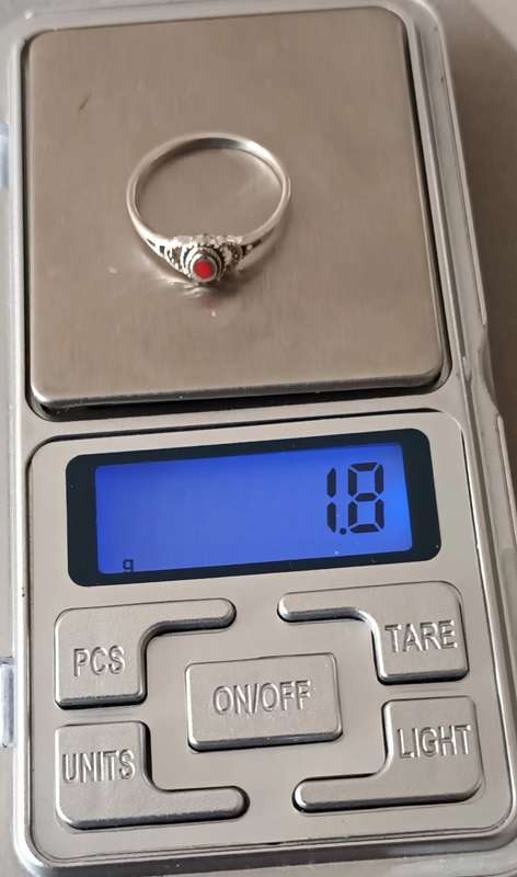 Sterling Silver Ring with Red Stone. 1.8g. Size O.