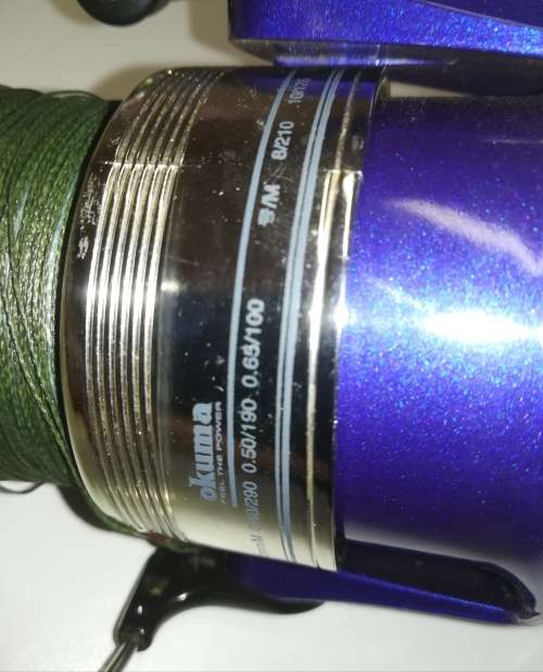 Large Okuma Chaser AX-65 fishing reel. Like new. With line & braid on.