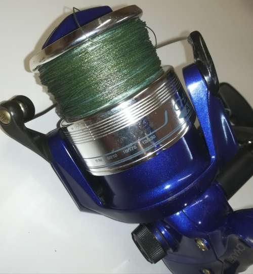 Large Okuma Chaser AX-65 fishing reel. Like new. With line & braid on.