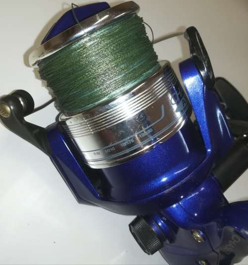 Large Okuma Chaser AX-65 fishing reel. Like new. With line & braid on.