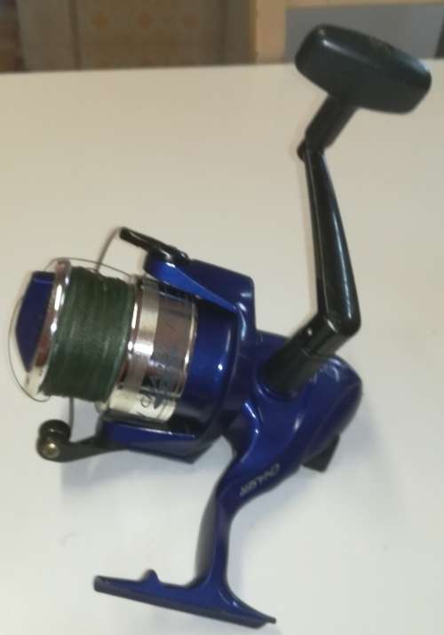 Large Okuma Chaser AX-65 fishing reel. Like new. With line & braid on.