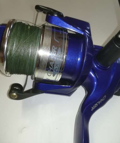 Large Okuma Chaser AX-65 fishing reel. Like new. With line & braid on.