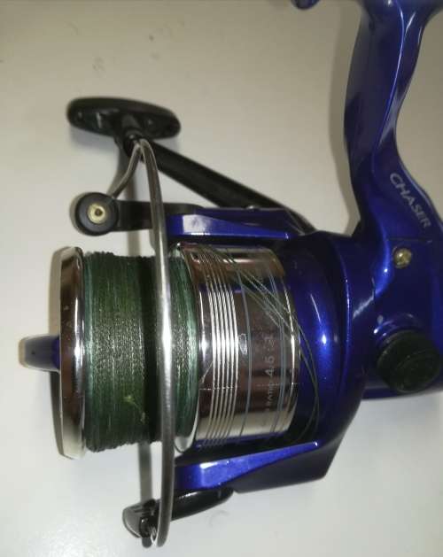 Large Okuma Chaser AX-65 fishing reel. Like new. With line & braid on.