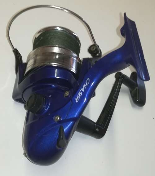 Large Okuma Chaser AX-65 fishing reel. Like new. With line & braid on.