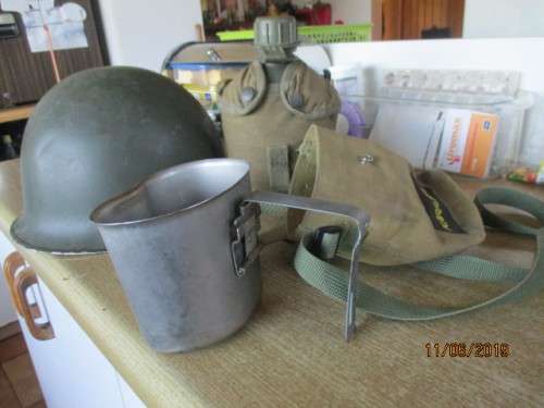 S A Army  steel helmet, water bottle and mess tin plus webbing