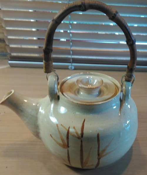 Oriental style pottery teapot