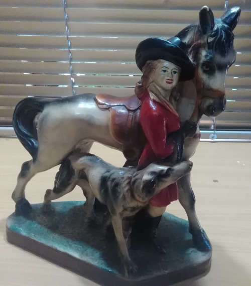 Lady with horse figurine