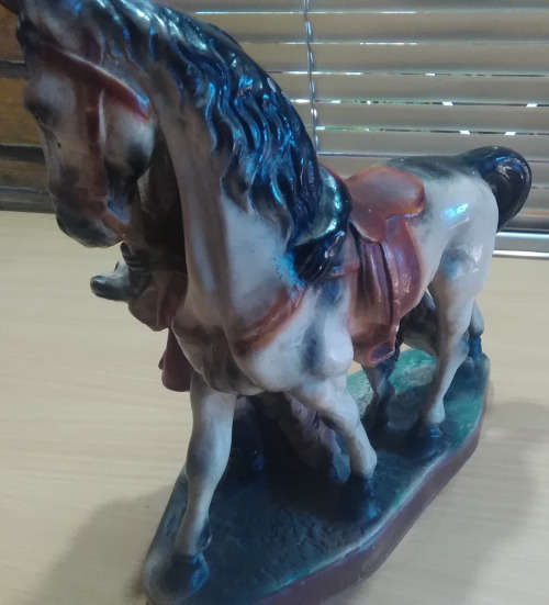 Lady with horse figurine
