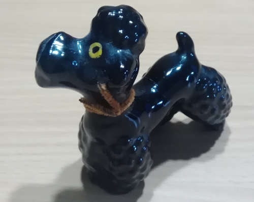 Black poodle dog figurine