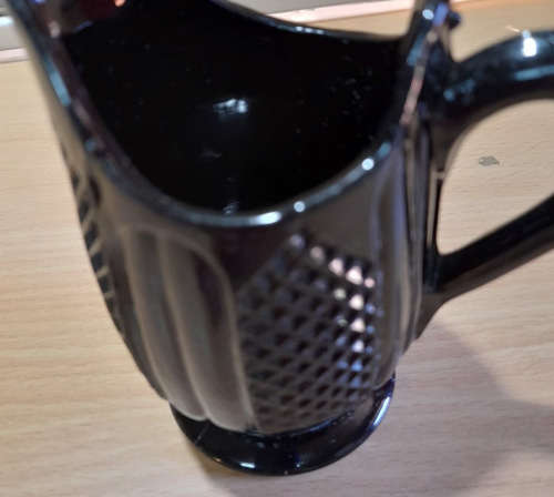 Victorian style black glass jug