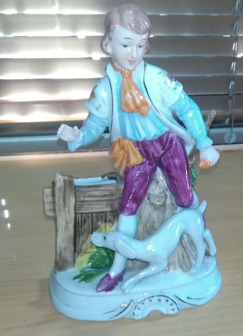 Boy and dog figurine bud vase