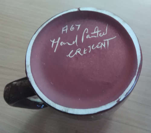 Hand painted Crescent pottery mug