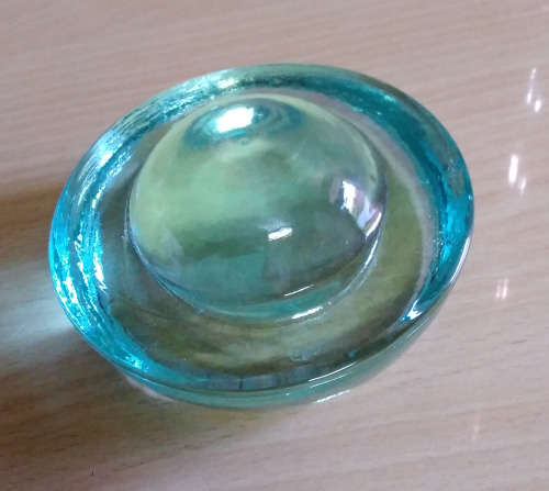 Glass cats eye paperweight