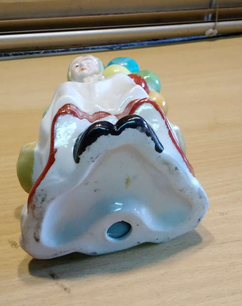 Balloon lady figurine