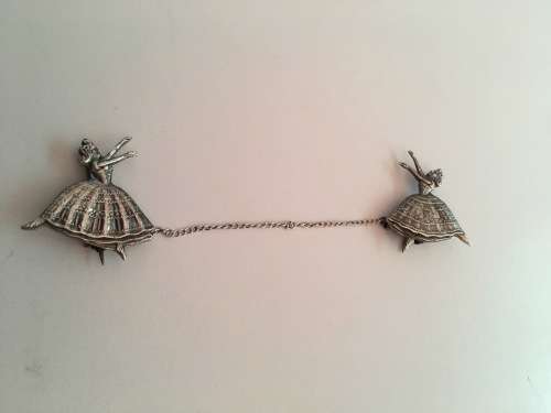 SILVER PAIR OF BALLERINA BROOCHES LINKED ON CHAIN