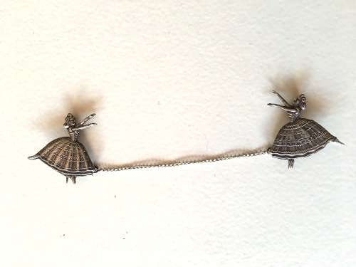 SILVER PAIR OF BALLERINA BROOCHES LINKED ON CHAIN