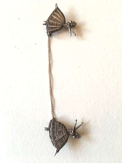 SILVER PAIR OF BALLERINA BROOCHES LINKED ON CHAIN
