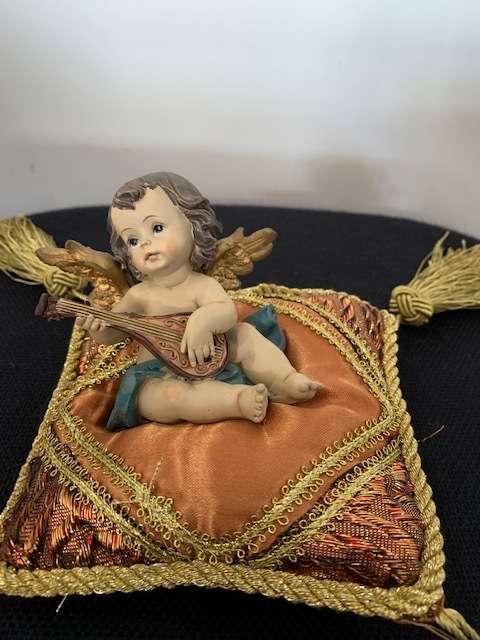 CHERUB PLAYING THE MANDOLIN SITTING ON GOLD BRAIDED CUSHION