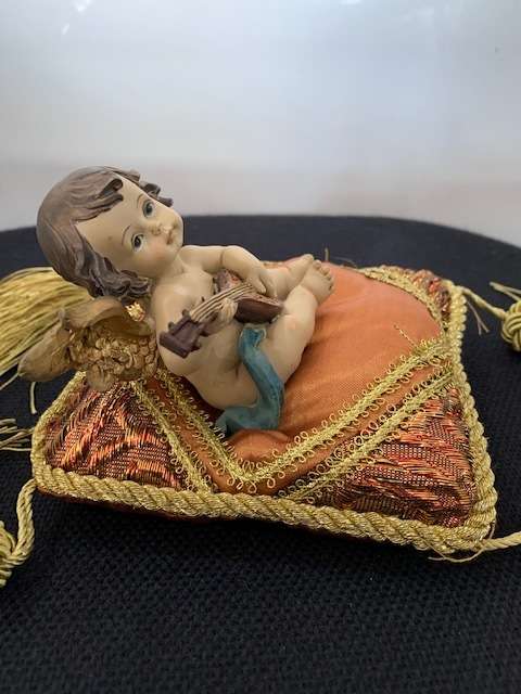 CHERUB PLAYING THE MANDOLIN SITTING ON GOLD BRAIDED CUSHION