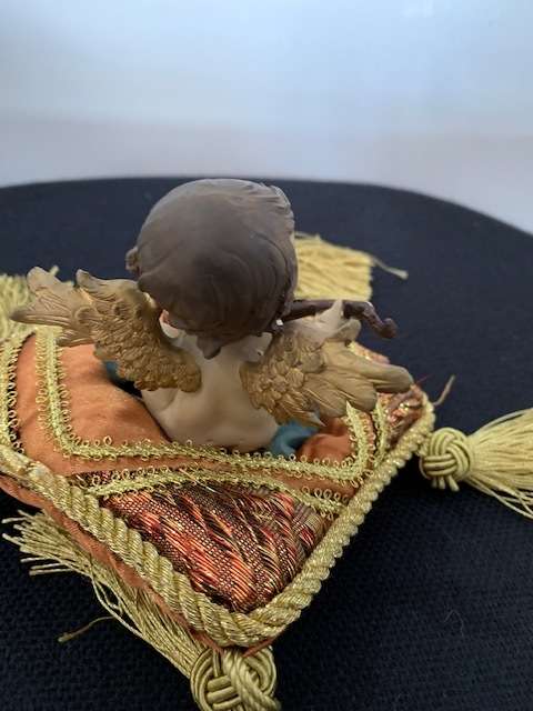 CHERUB PLAYING THE MANDOLIN SITTING ON GOLD BRAIDED CUSHION